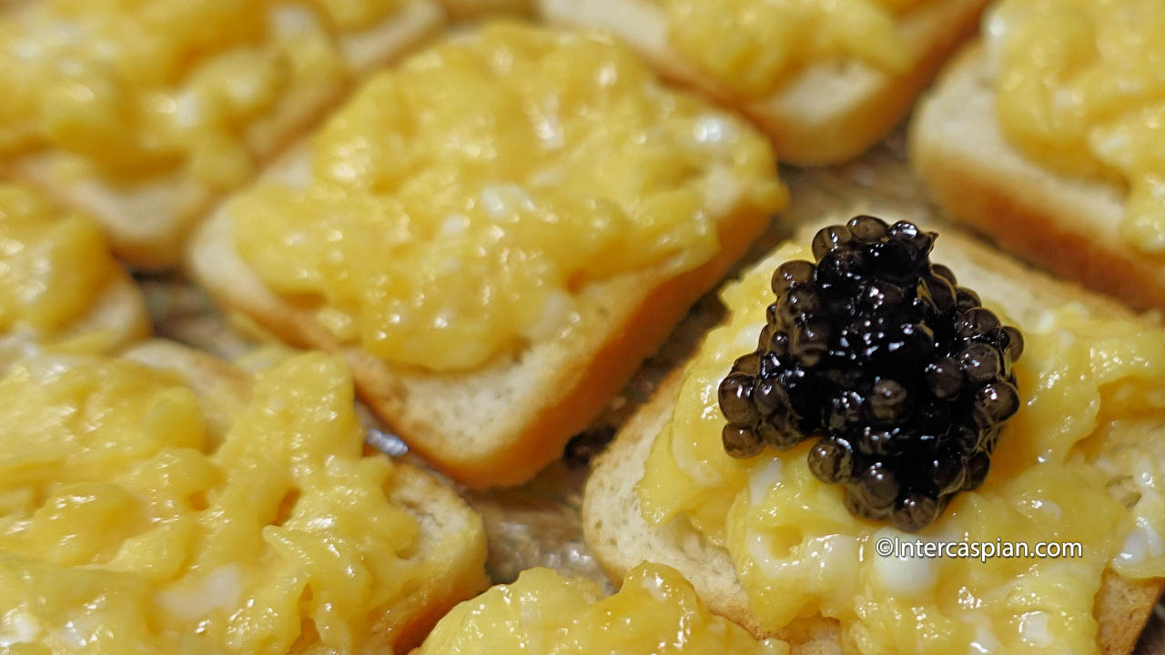 Quail egg topped with Iranian beluga caviar served over a piece of lightly toasted white bread