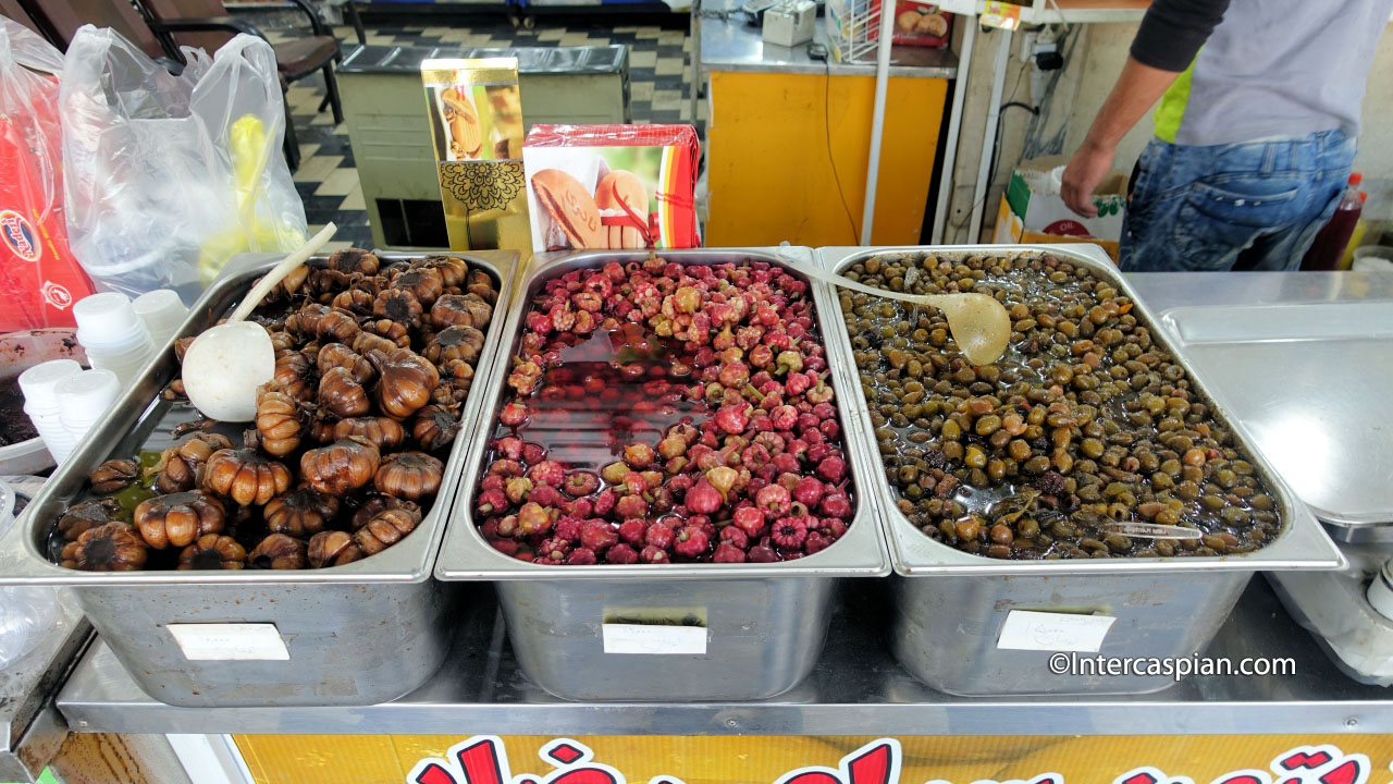 Regional specialty olives, pickled garlics and garlic flowers