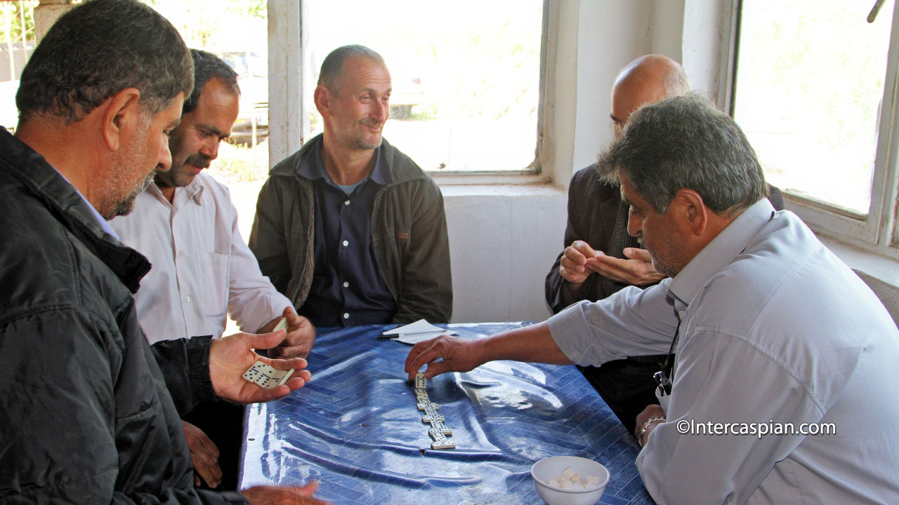 Villagers playing dominos game