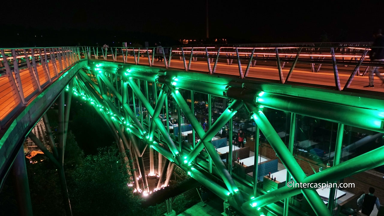 Night photo of upper and lower levels of the Nature Bridge