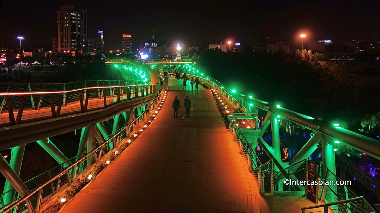 Night photo of the upper level of Nature Bridge from the south